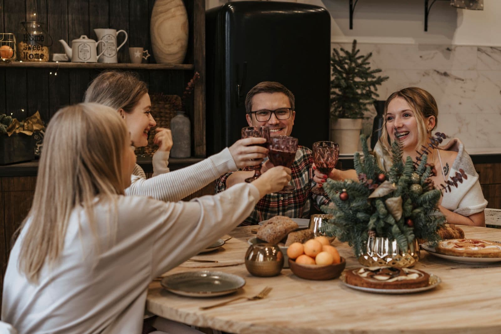 Friends making a toast across the table